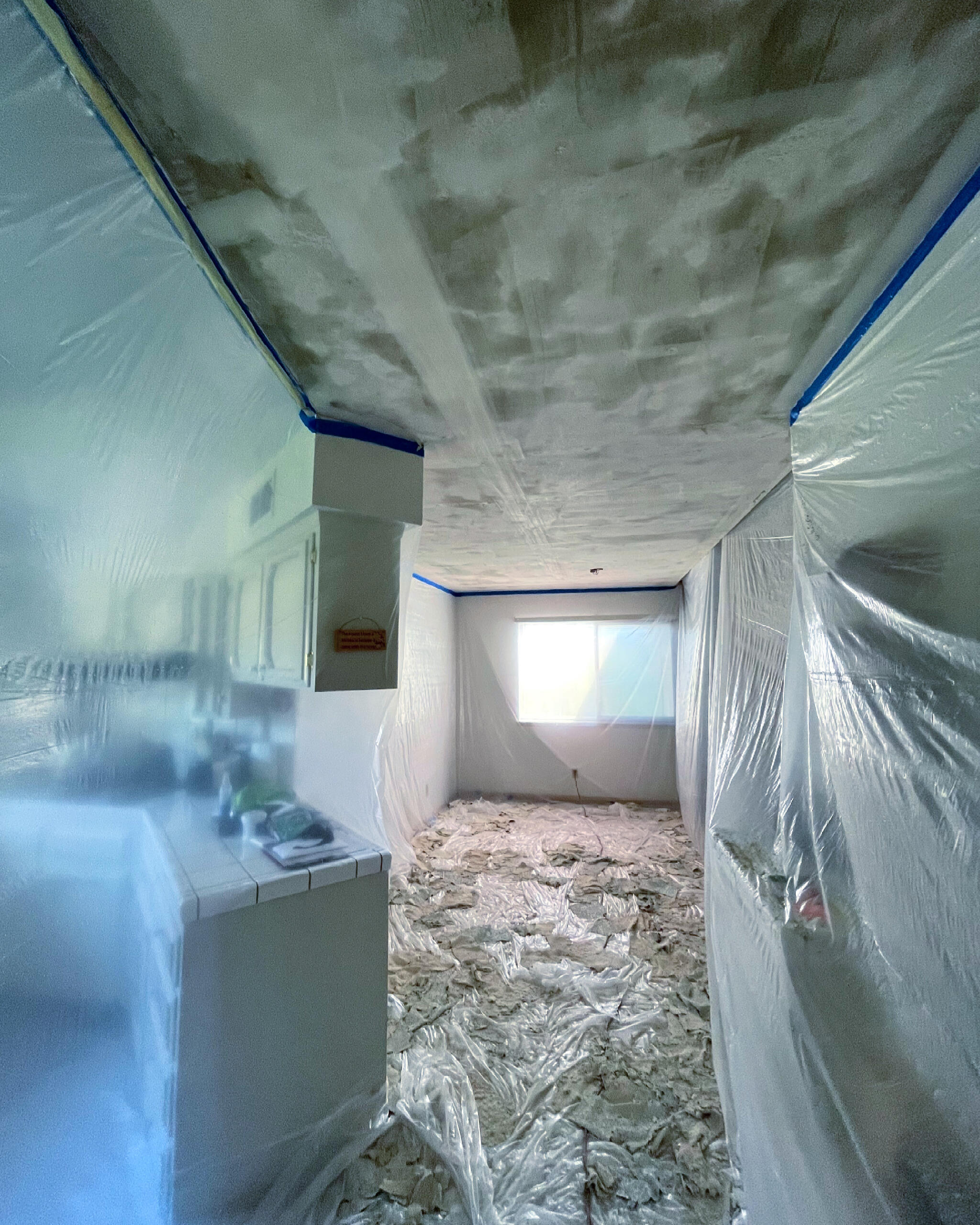 Fresno popcorn ceiling removal in progress